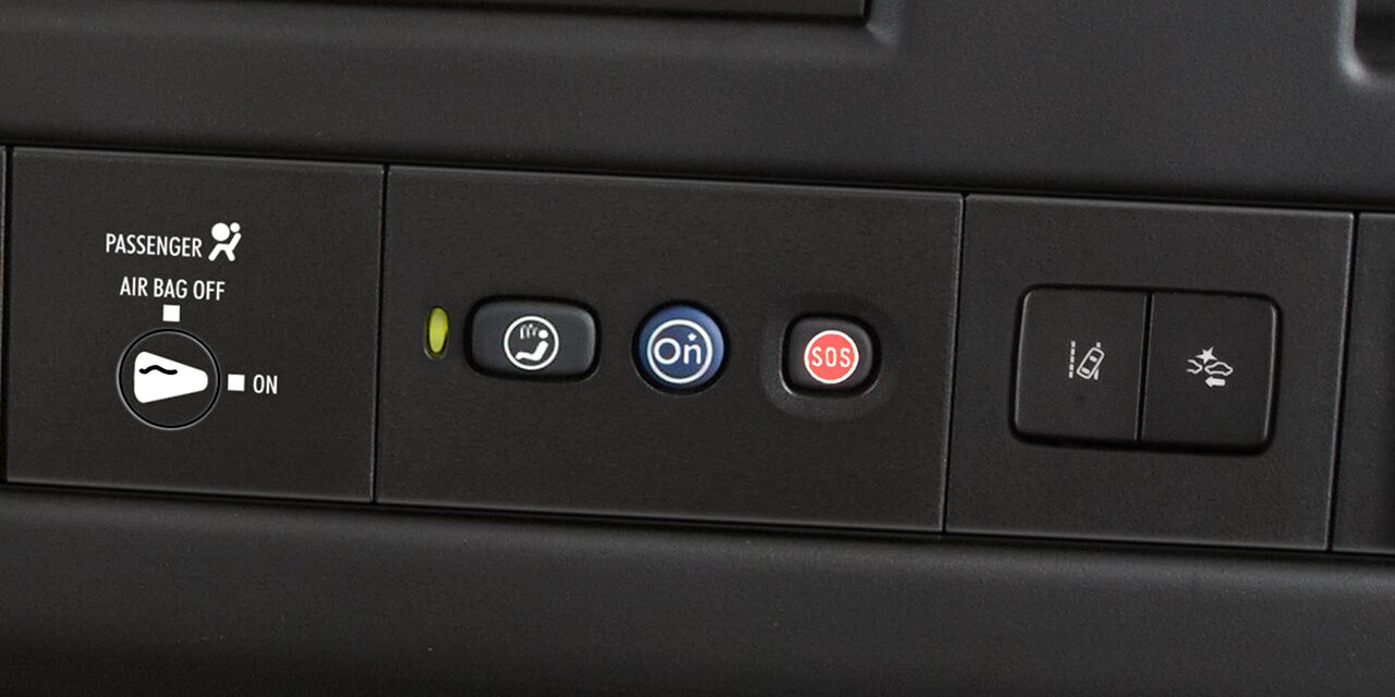 Close-Up View of OnStar and Emergency Services Buttons in a 2026 GMC Cargo Passenger Van