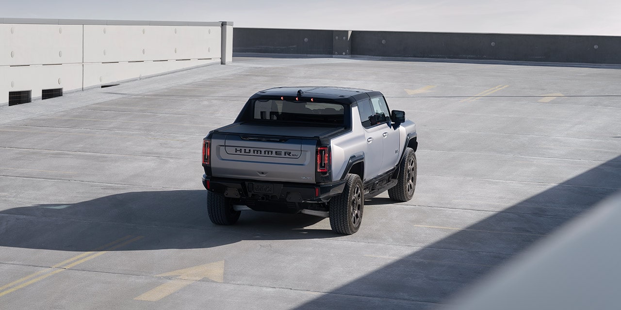 Bird's Eye View of the Rear End of a 2026 GMC HUMMER EV Electric Truck Parked on the Top Level of a Parking Garage