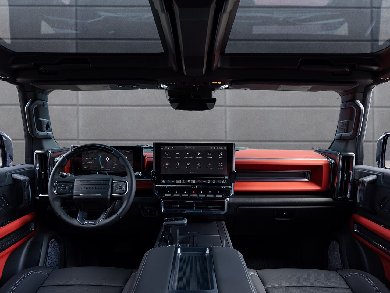 Back Seat View of the 2026 HUMMER EV Front Row Interior and Cabin in Velocity Ember Color Theme