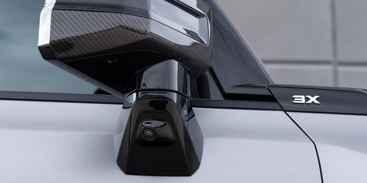 Close-up View of One of the 2026 GMC HUMMER EV SUV's Ultra Vision Cameras on the Exterior Side Mirror