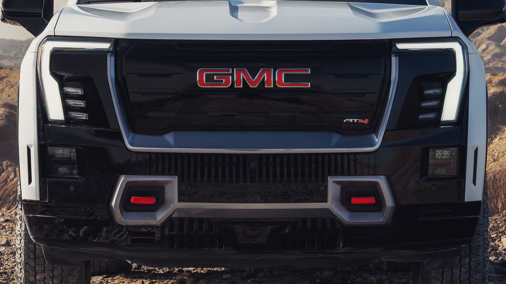 Front View of the 2026 GMC Sierra EV AT4 and the Front Recovery Hooks