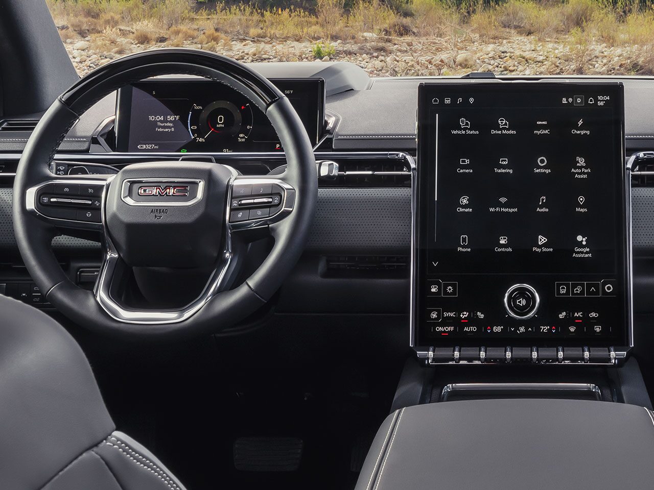 Interior View of the Steering Wheel, Infotainments System, and Dashboard in the 2026 GMC Sierra EV AT4
