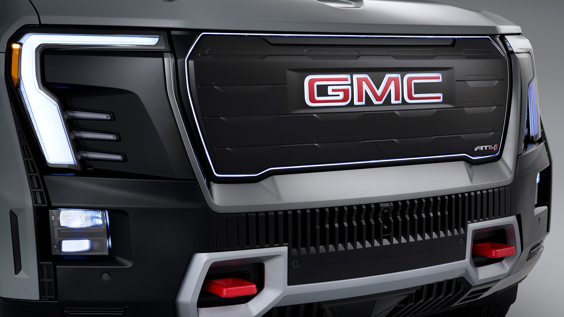 Close-up of the Sierra EV Illuminated Perimeter GMC Badge grille.