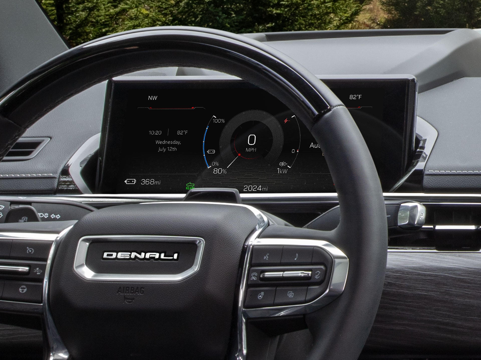 Close-up of the 2026 Sierra EV Pickup Truck's Driver Information Center Behind the Steering Wheel
