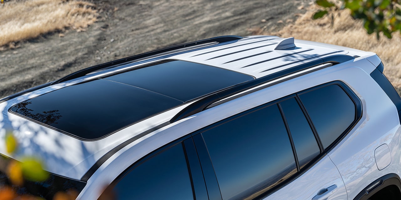 Exterior Bird-eye View of the 2026 GMC Acadia AT4 Mid-Size Off-Road SUVs Sunroof