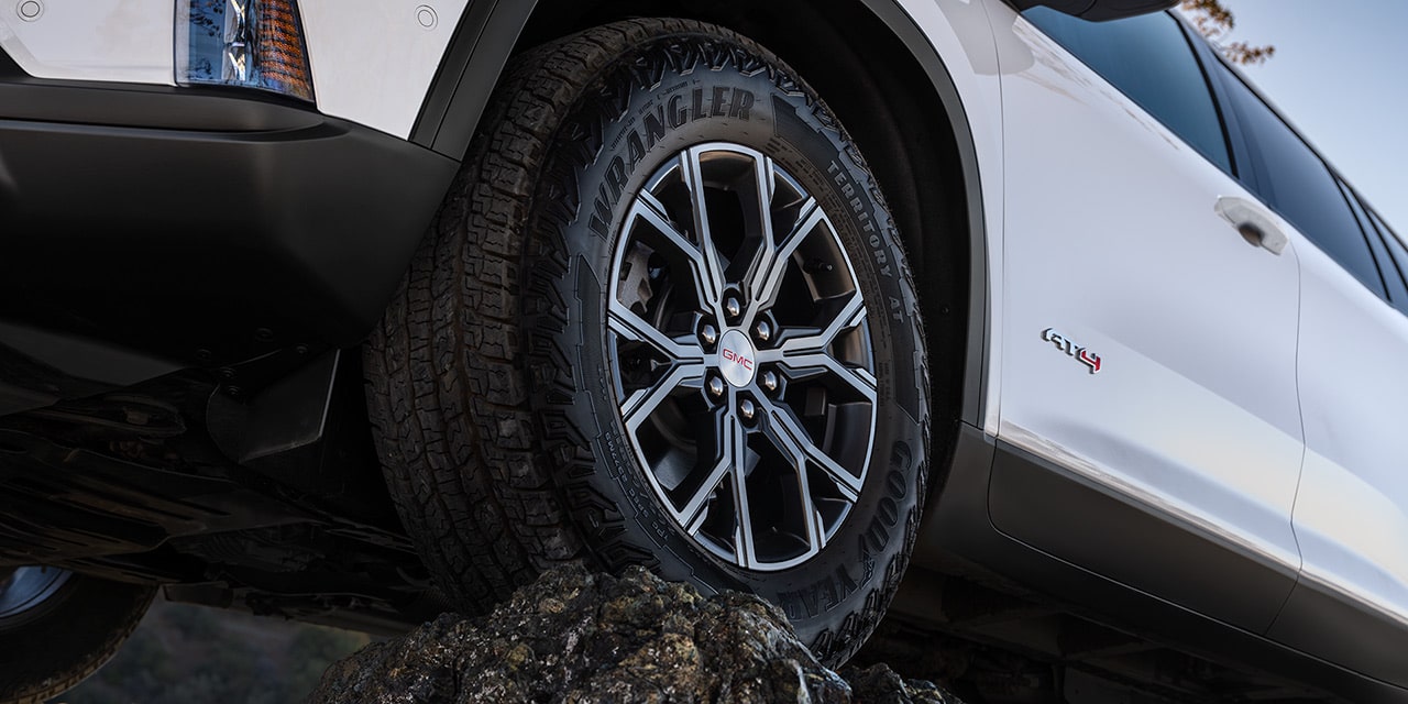 Close-up of the Dark Machined Aluminum Wheel on the 2026 GMC Acadia AT4 Mid-Size Off-Road SUV