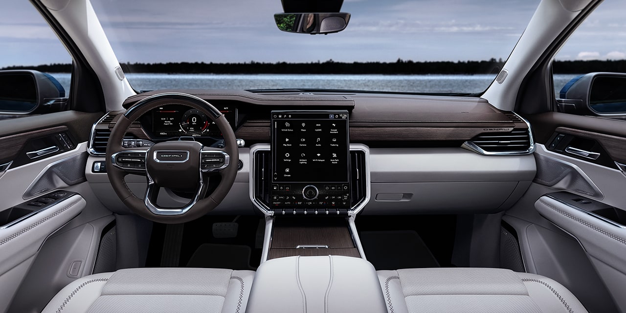 Interior View of the Steering Wheel and Dashboard in the 2026 GMC Acadia Denali Luxury Mid-Size SUV