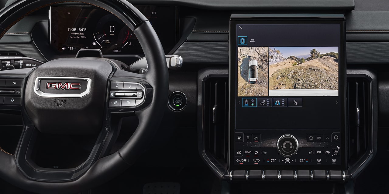 Interior View of the Steering Wheel and Infotainment System in the 2026 GMC Acadia