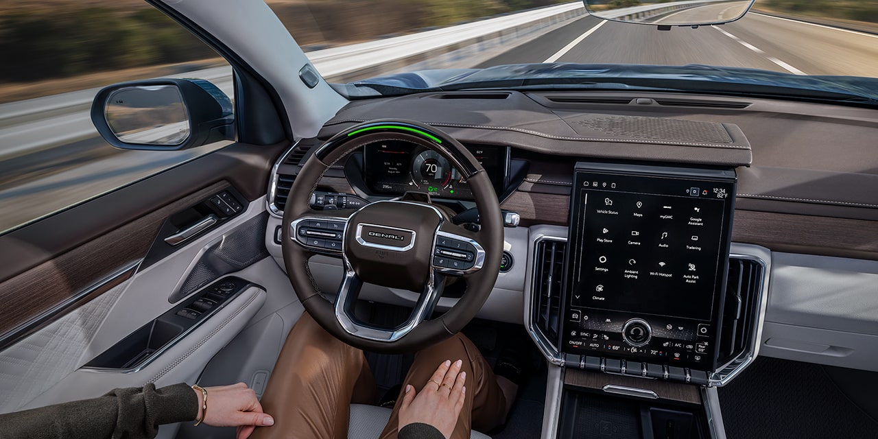 View of the Driver Using Super Cruise Hands Free Driving Assist in the 2026 GMC Acadia Denali Luxury Mid-Size SUV