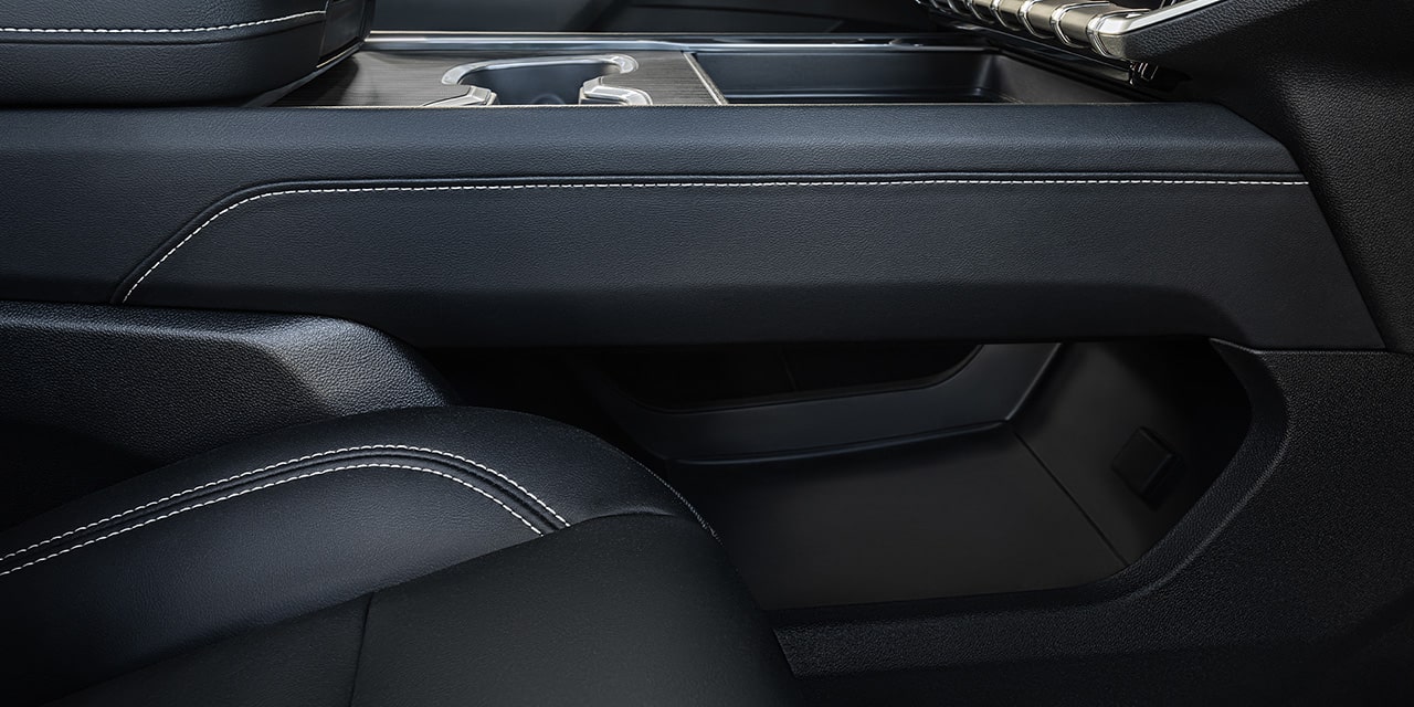 Interior View of the Storage Under the Front Console 2026 GMC Acadia Mid-Size SUV