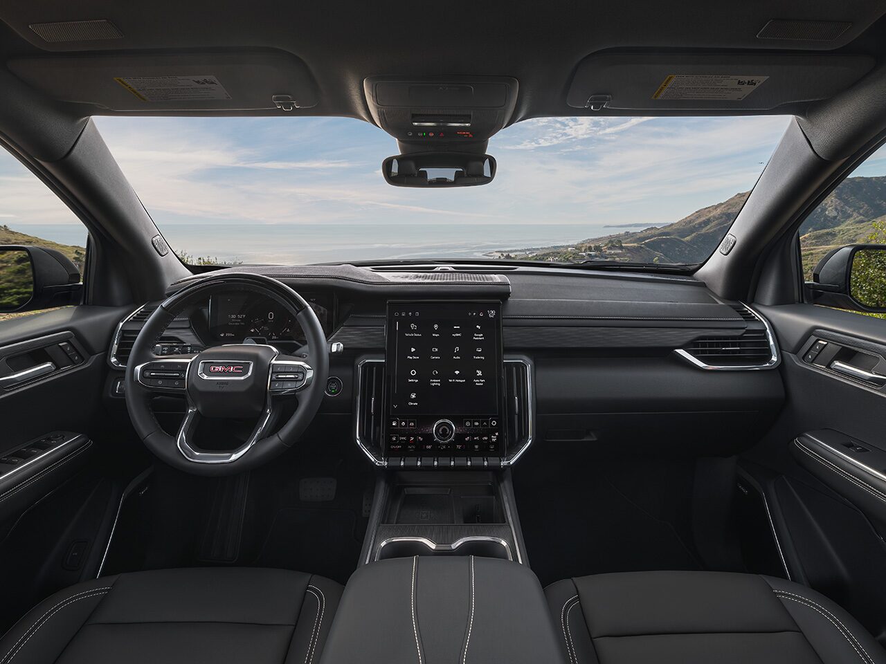 Interior View of the Dashboard and Steering Wheel in the 2026 GMC Acadia Elevation Mid-Size SUV