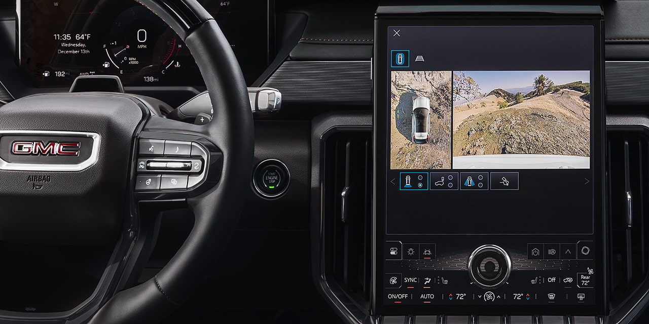 Interior View of the Steering Wheel and Infotainment System in the 2026 GMC Acadia