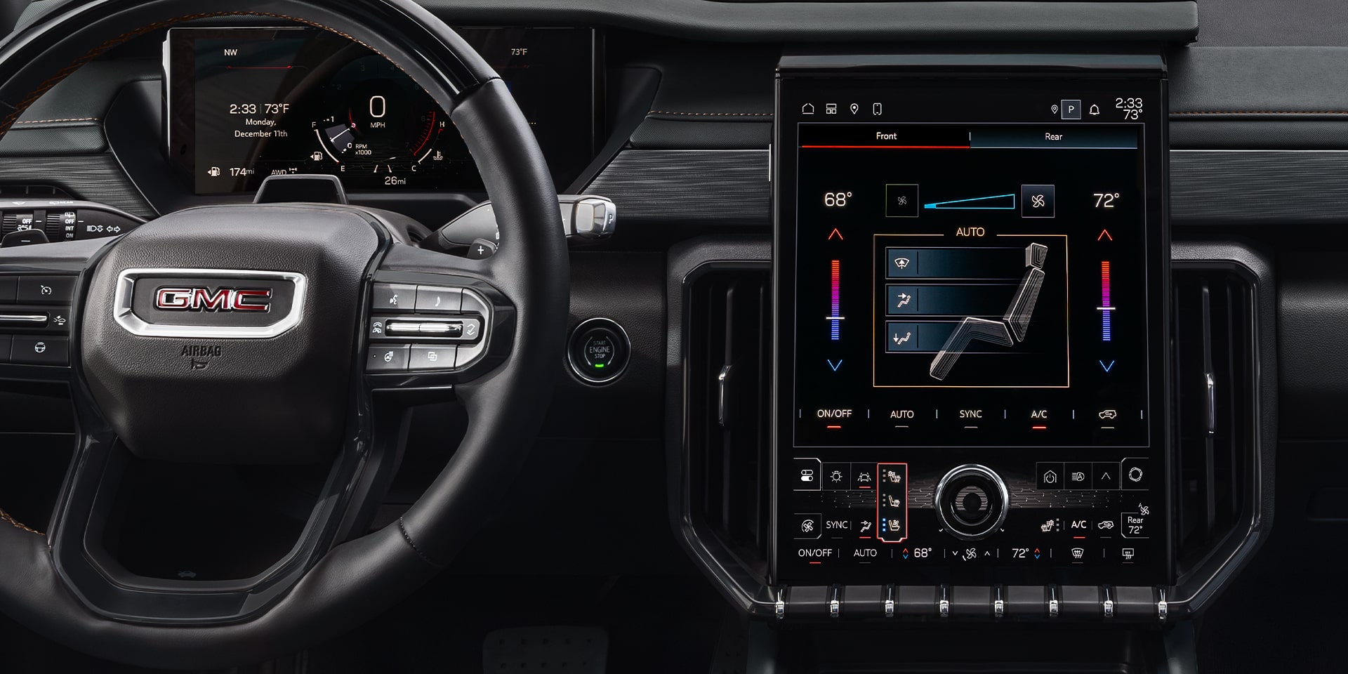 Close-up of the Interior View of the Steering Wheel and Infotainment System in the 2026 GMC Acadia MId-Size SUV