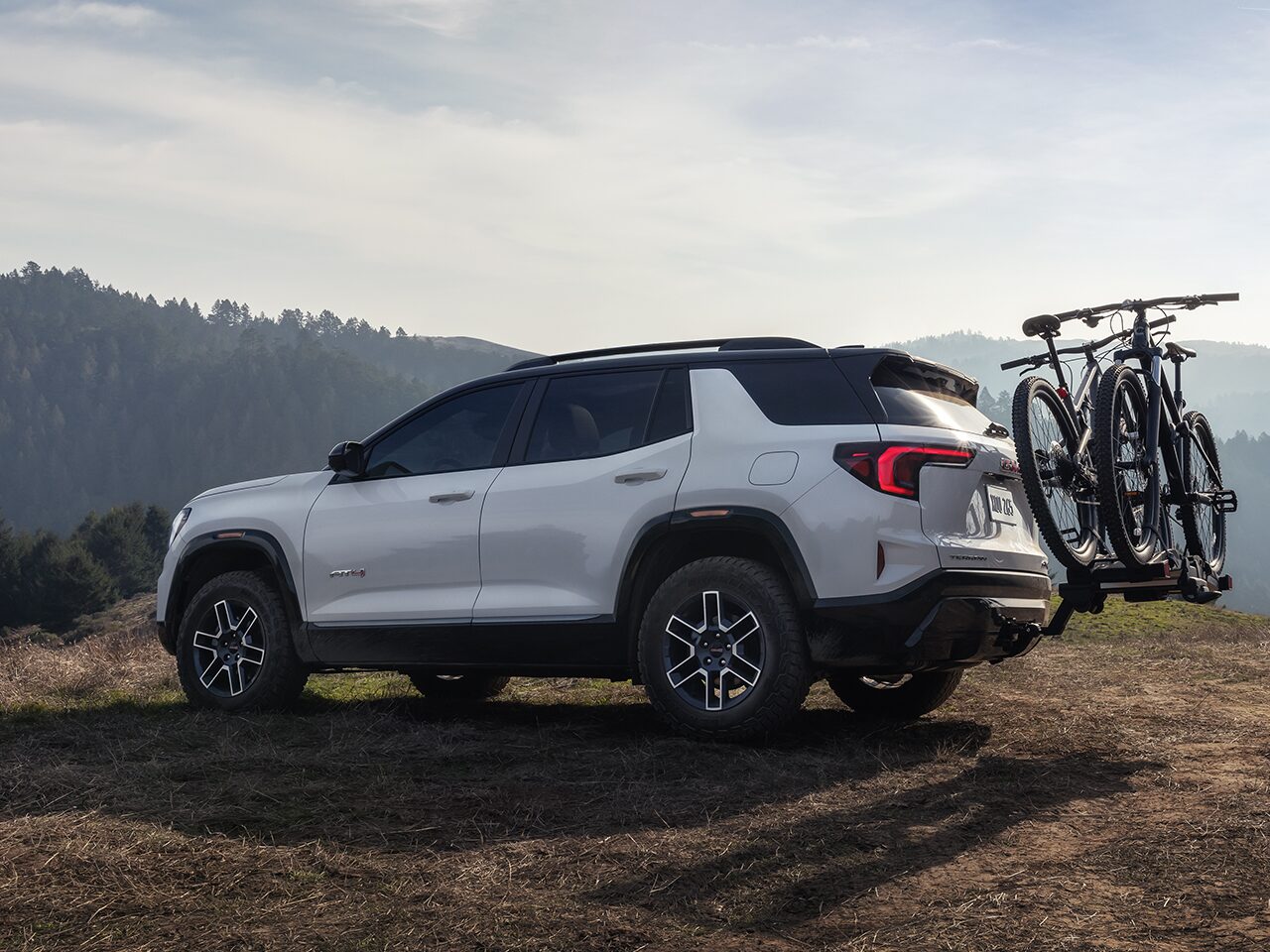 Profile View of the 2026 GMC Terrain AT4 Small Off-Road SUV with a Bike Rack Attached