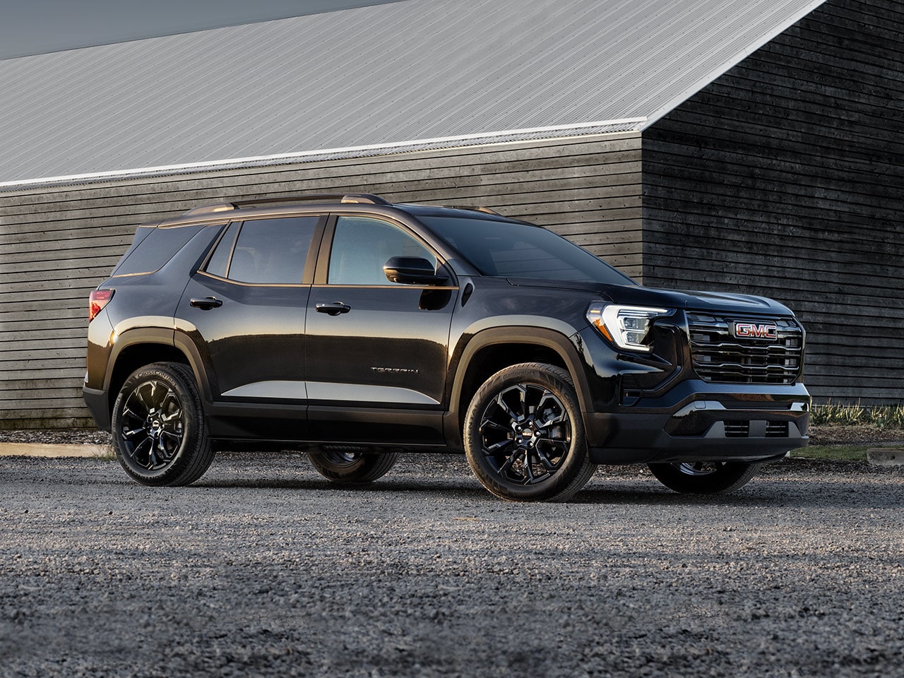 Profile View of the 2026 GMC Terrain Elevation Compact SUV Parked in a Driveway