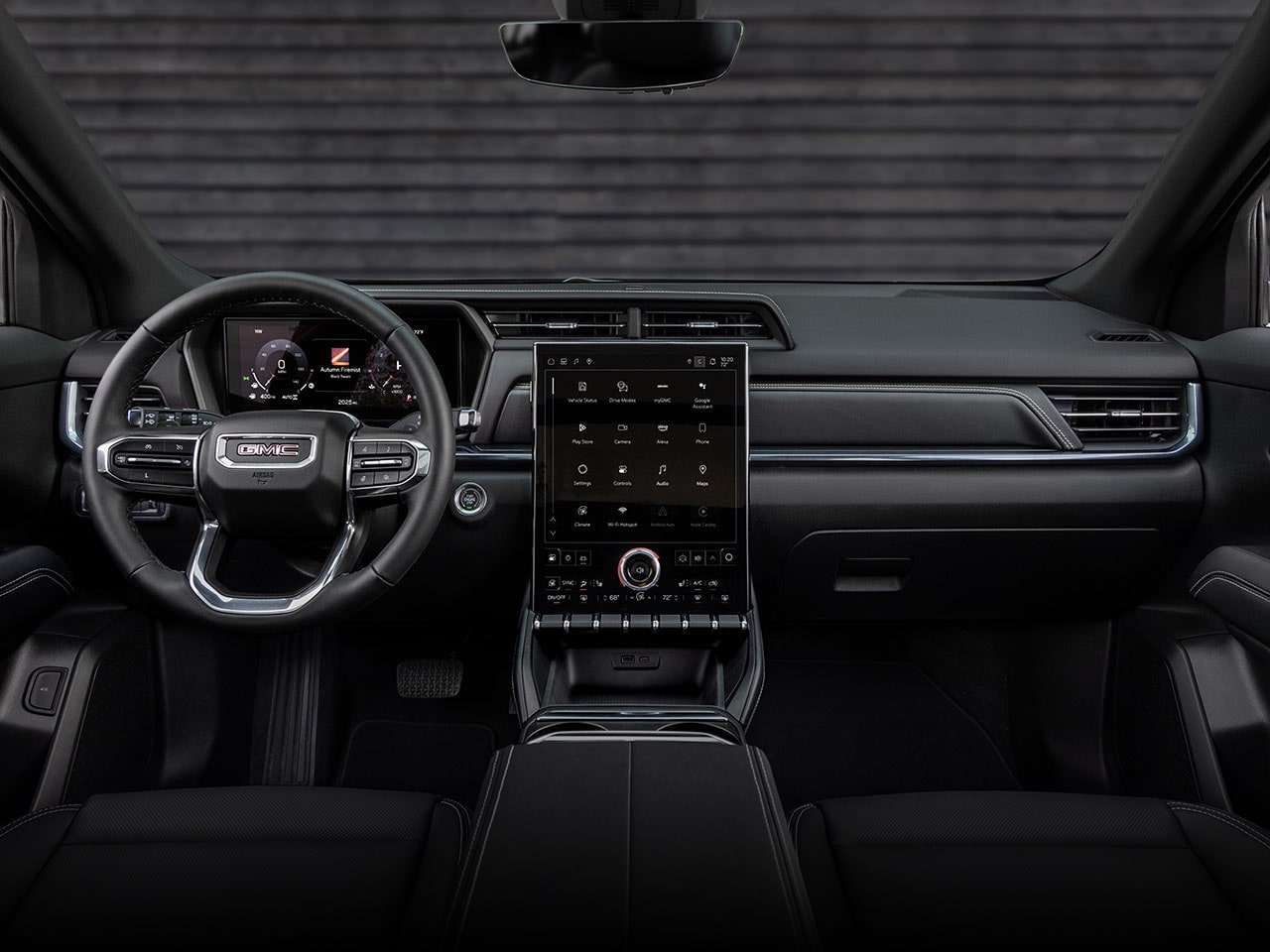 Interior View of the Dashboard, Steering Wheel, and Infotainment System in the 2026 GMC Terrain Denali Luxury Compact SUV