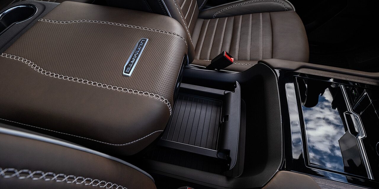 Close-up of the Power-Sliding Center Console in the 2026 GMC Yukon AT4 Ultimate Full-Size Off-Road SUV