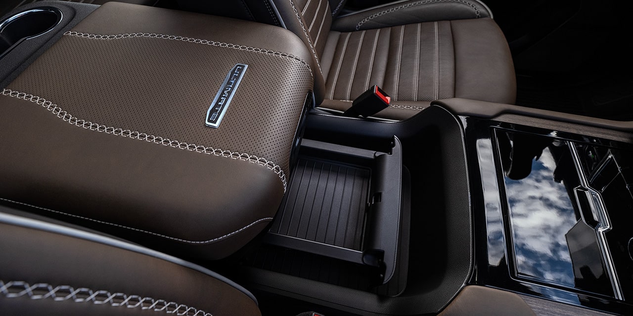 Close-up of the Power-Sliding Center Console in the 2026 GMC Yukon Elevation Full-Size SUV