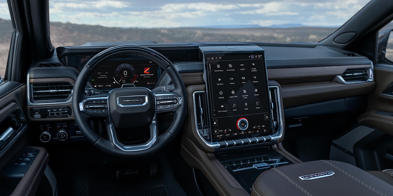 Interior View From the Drivers Side of the Steering Wheel and the 16.8 Inch Premium GMC Infotainment System in the 2026 GMC Yukon
