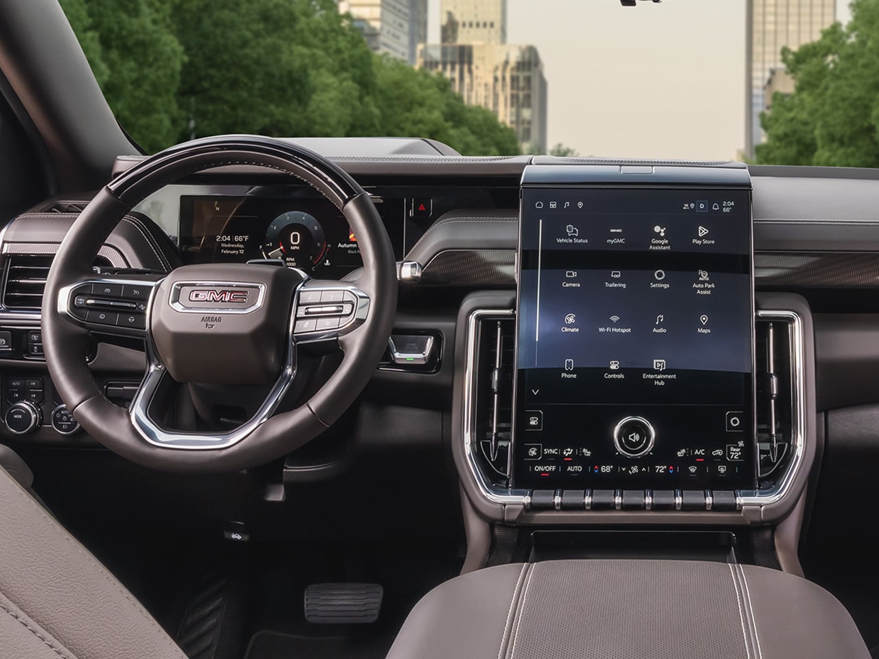 Interior View of the Steering Wheel and Infotainment System in the 2026 GMC Yukon Denali Ultimate
