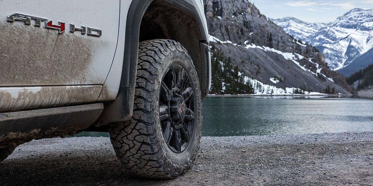 Close-up View of the "AT4 HD" Badging and Wheel on a 2026 GMC Sierra HD AT4 Heavy Duty Off-Road Truck
