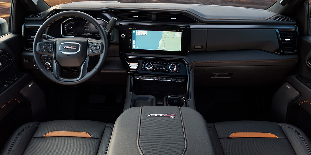 Interior View of Front Seats and the Dashboard in a 2026 GMC Sierra HD AT4 Heavy Duty Off-Road Truck