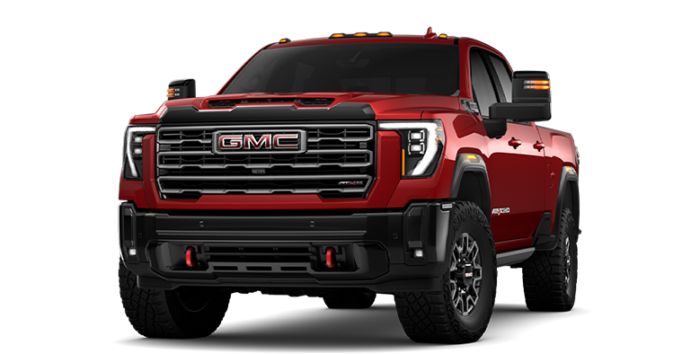Front Three-Quarters View of the GMC 2026 Sierra HD AT4X Heavy Duty Off-Road Truck in the Color Volcanic Red