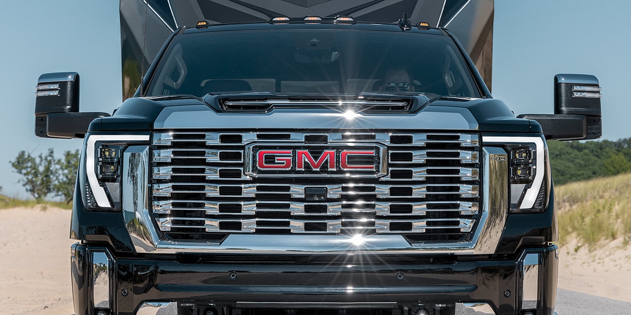 Front View of the Grille on a 2026 GMC Sierra HD Denali Luxury Truck While Hauling a Trailer
