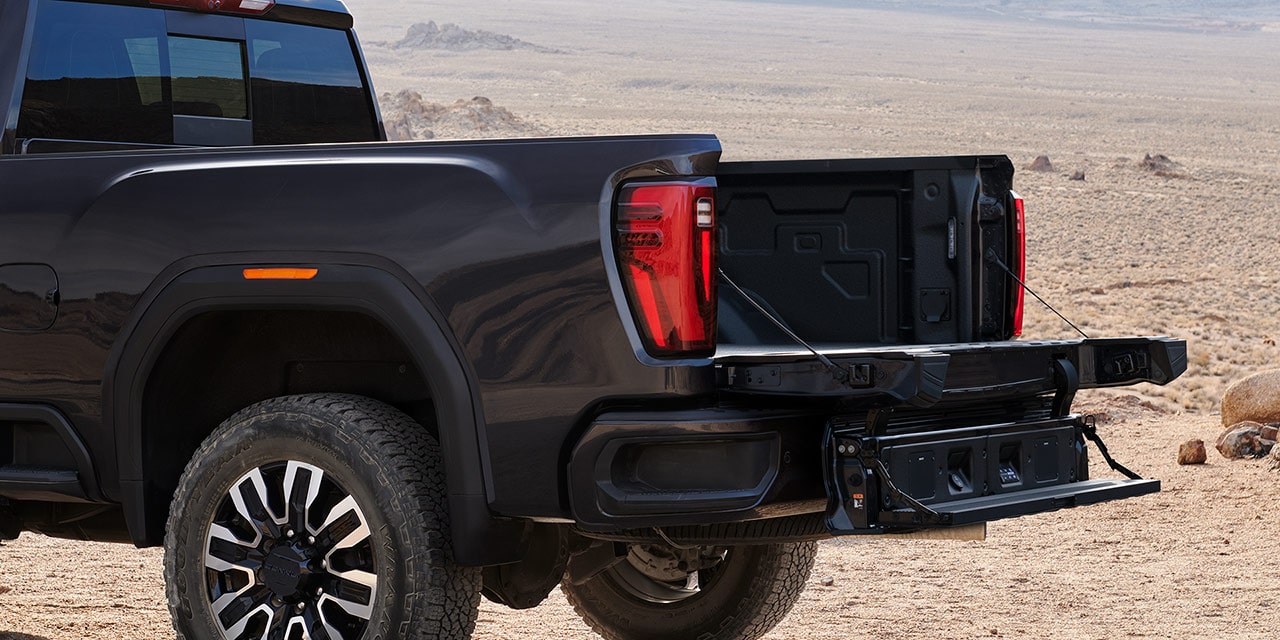 Close-up View of the MultiPro Tailgate with Step Lowered on a 2026 GMC Sierra HD Denali Luxury Truck