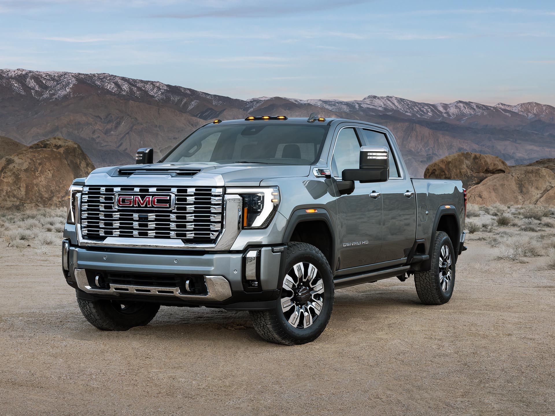 Wide Front Three-Quarters View of the 2026 GMC Sierra HD Denali Luxury Truck in the Desert