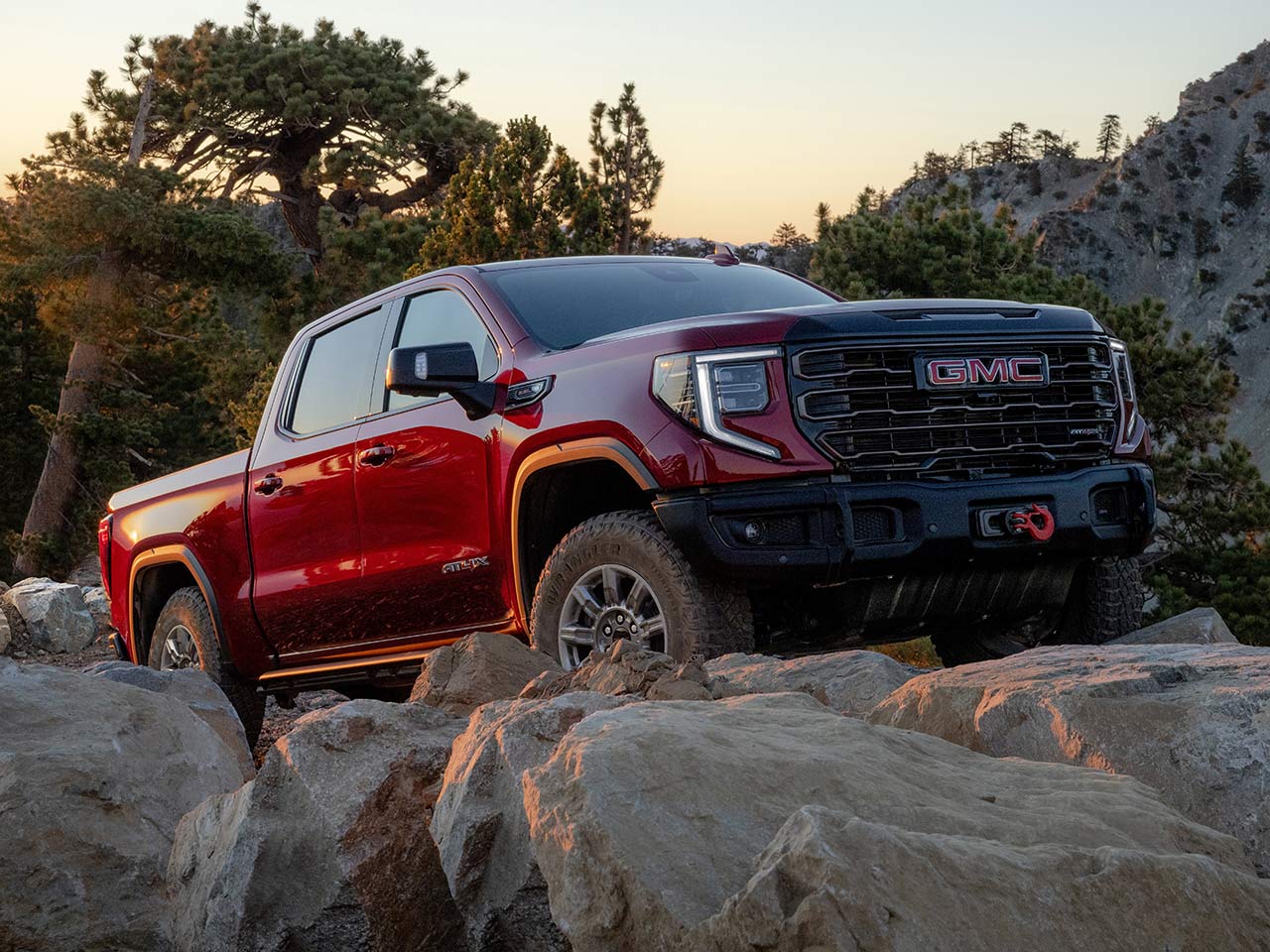 The 2026 GMC Sierra At4 Off-Road Truck Driving Over Rough Terrain