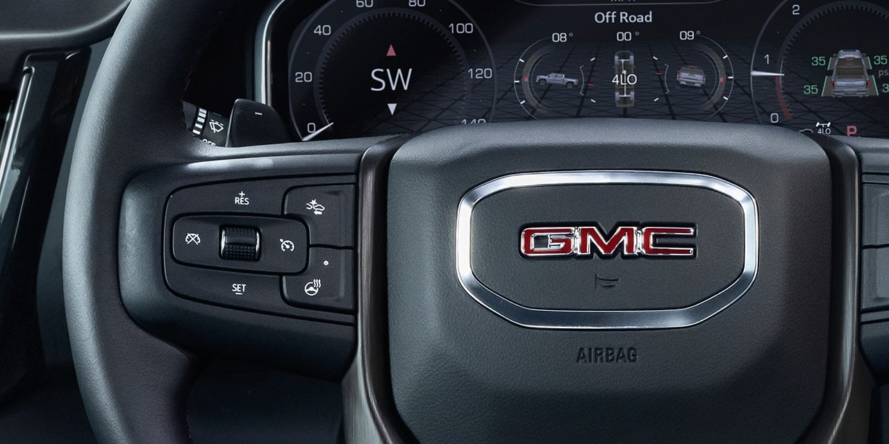 Close-up View of the Adaptive Cruise Control Button on the Steering Wheel