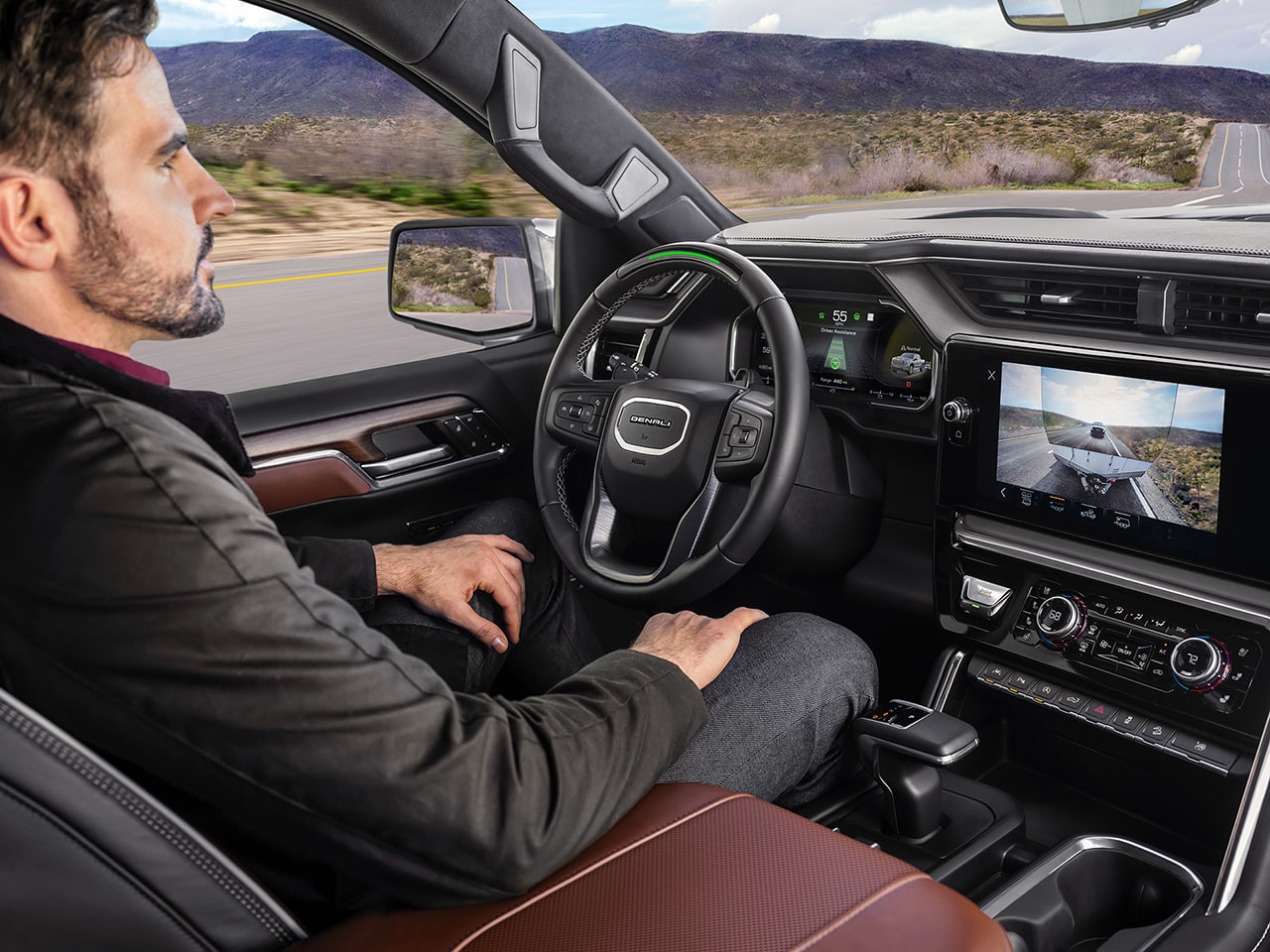 Profile View of a Name Driving the 2026 GMC Sierra 1500 Pickup Truck Using the Super Cruise Hands-Free Driving Technology