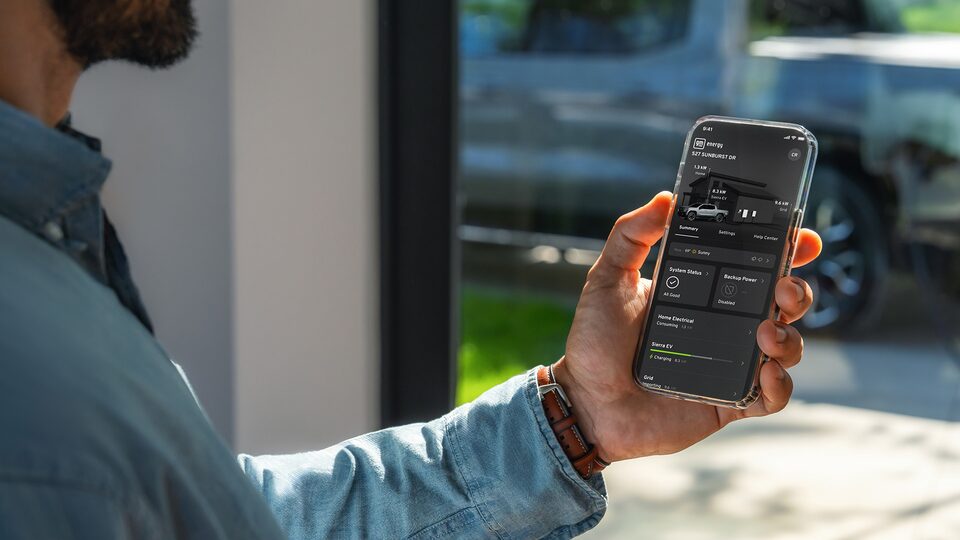 Close-up of the Vehicle's Infotainment System Displaying the GMC EV's Current Range and Charging Level